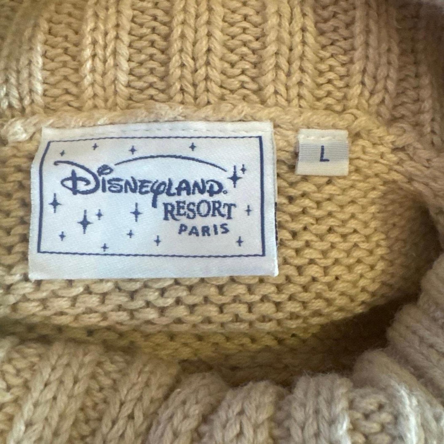 Disneyland resort, Paris original label turtleneck jumper with embroidered Winnie the Pooh emblem on the front size large in good condition