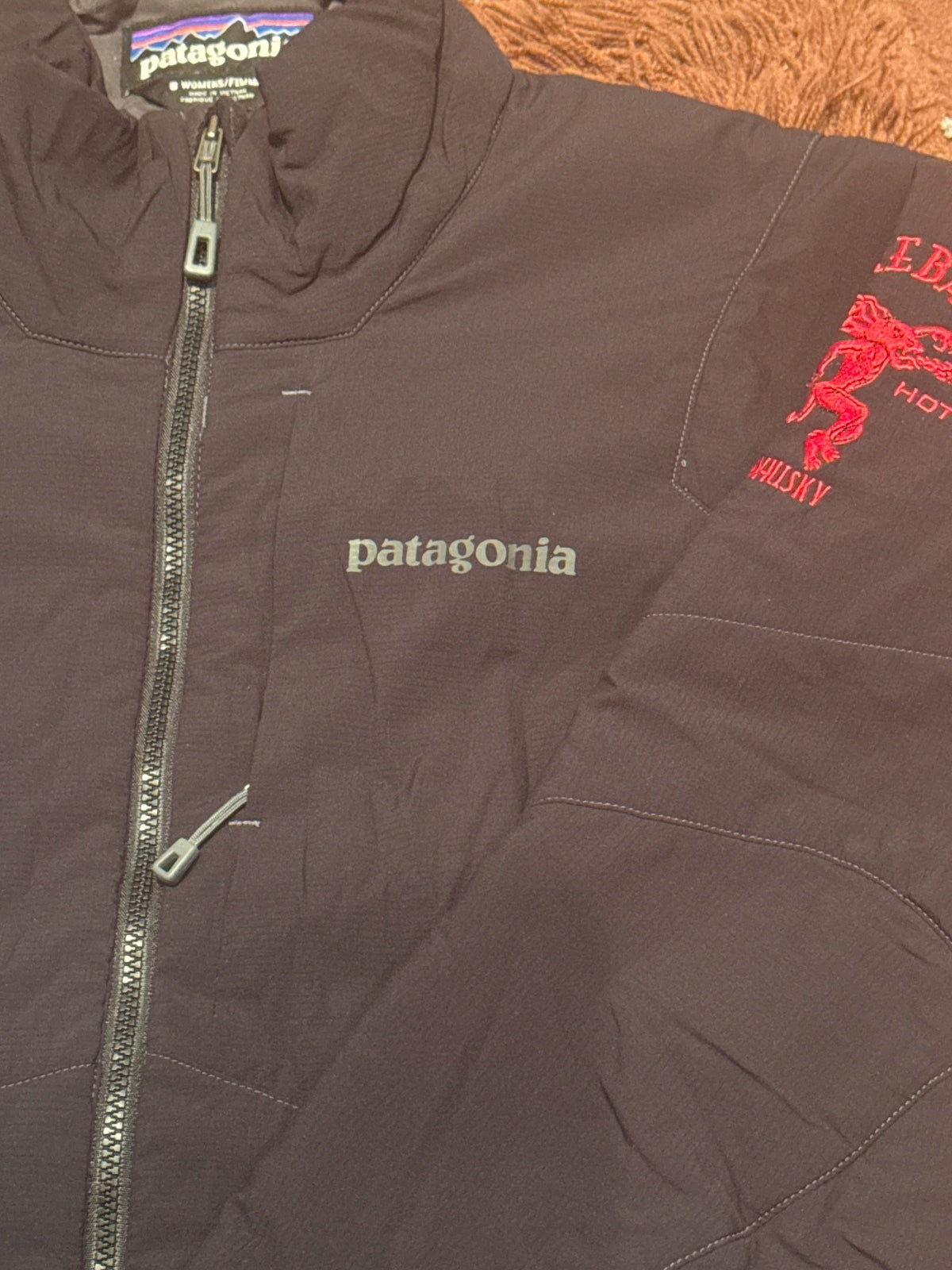 Patagonia Women's Small Black Jacket with Fireball Whisky Em